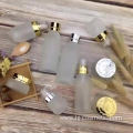 wholesales High-grade golden carved ABS cap transparent glass cosmetic bottles/jars with good price